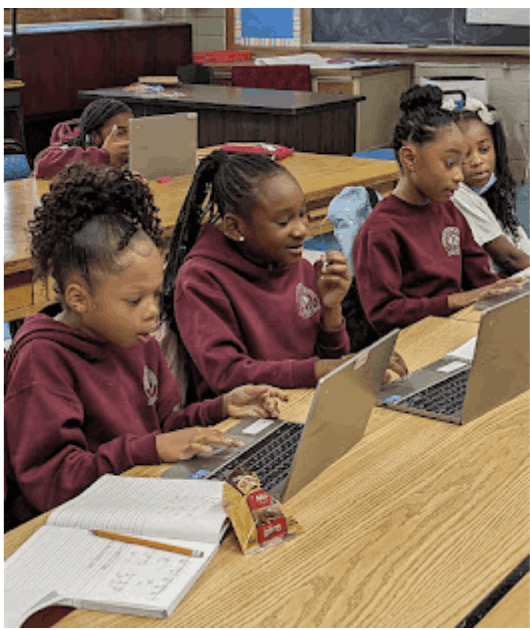 Tutor helping student practice addition, subtraction, multiplication, and division in arithmetic tutoring session